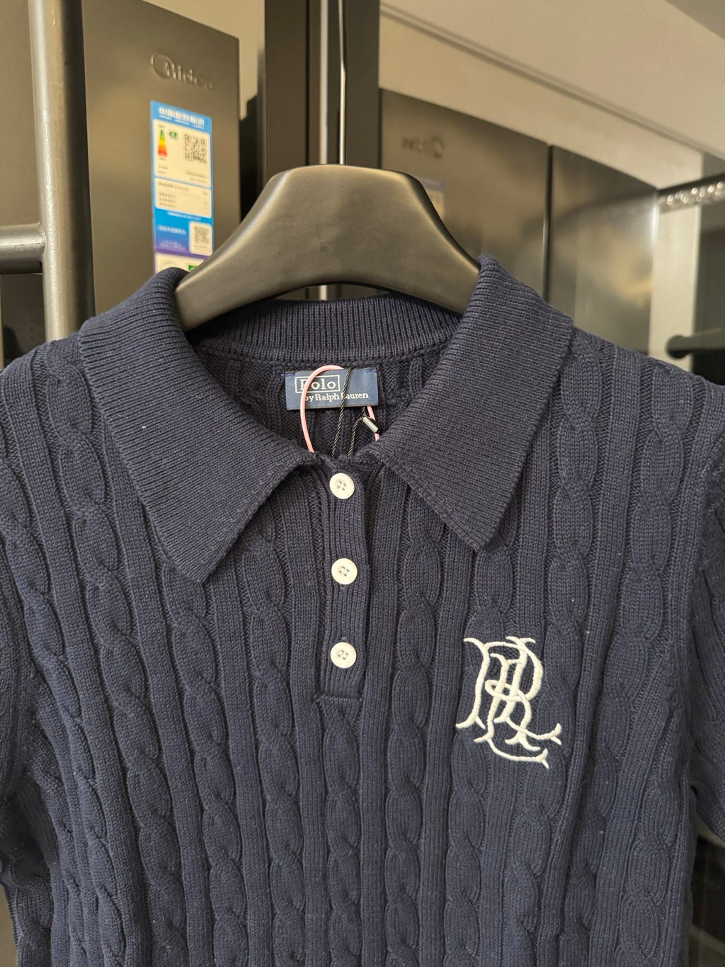 Ralph Lauren cable-knit polo shirt close-up, navy, polo collar, logo and buttons