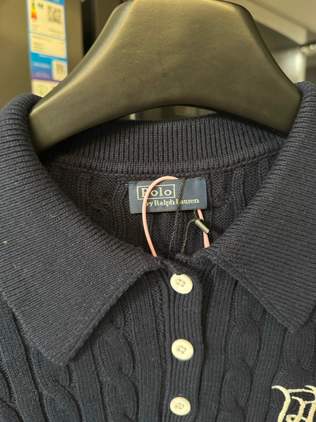 Ralph Lauren knit polo collar close-up, dark navy, three-button placket