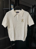 Ralph Lauren ivory cable-knit polo shirt, short sleeves, button placket