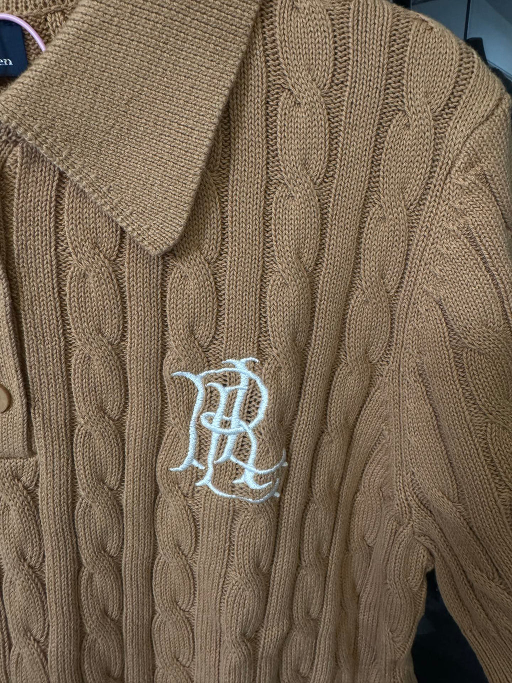 Ralph Lauren cable-knit polo shirt in beige, chest logo embroidery on textured knit.