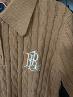 Ralph Lauren cable-knit polo shirt in beige, chest logo embroidery on textured knit.