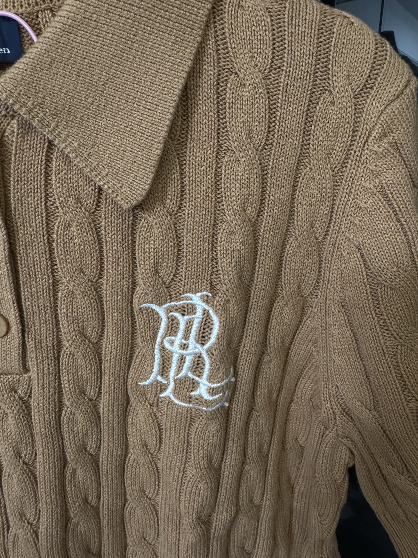 Ralph Lauren cable-knit polo shirt in beige, chest logo embroidery on textured knit.