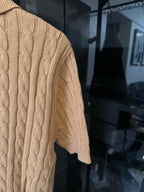 Ralph Lauren cable-knit polo shirt in beige, textured knit sleeve and side panel view.