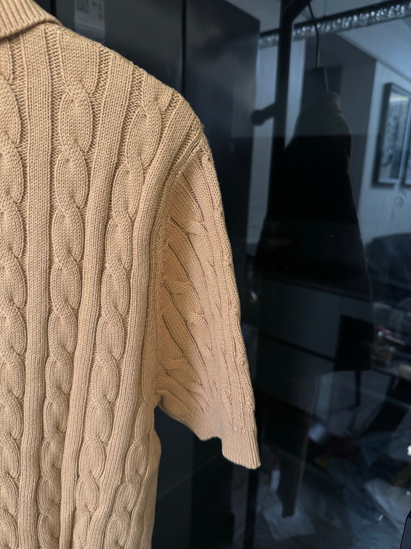 Ralph Lauren cable-knit polo shirt in beige, textured knit sleeve and side panel view.