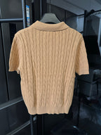 Ralph Lauren cable-knit polo shirt in beige, back view with ribbed collar and sleeve cuffs.
