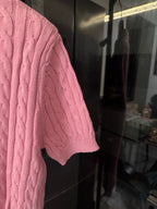Pink cable-knit polo shirt sleeve with knit texture and RL chest emblem