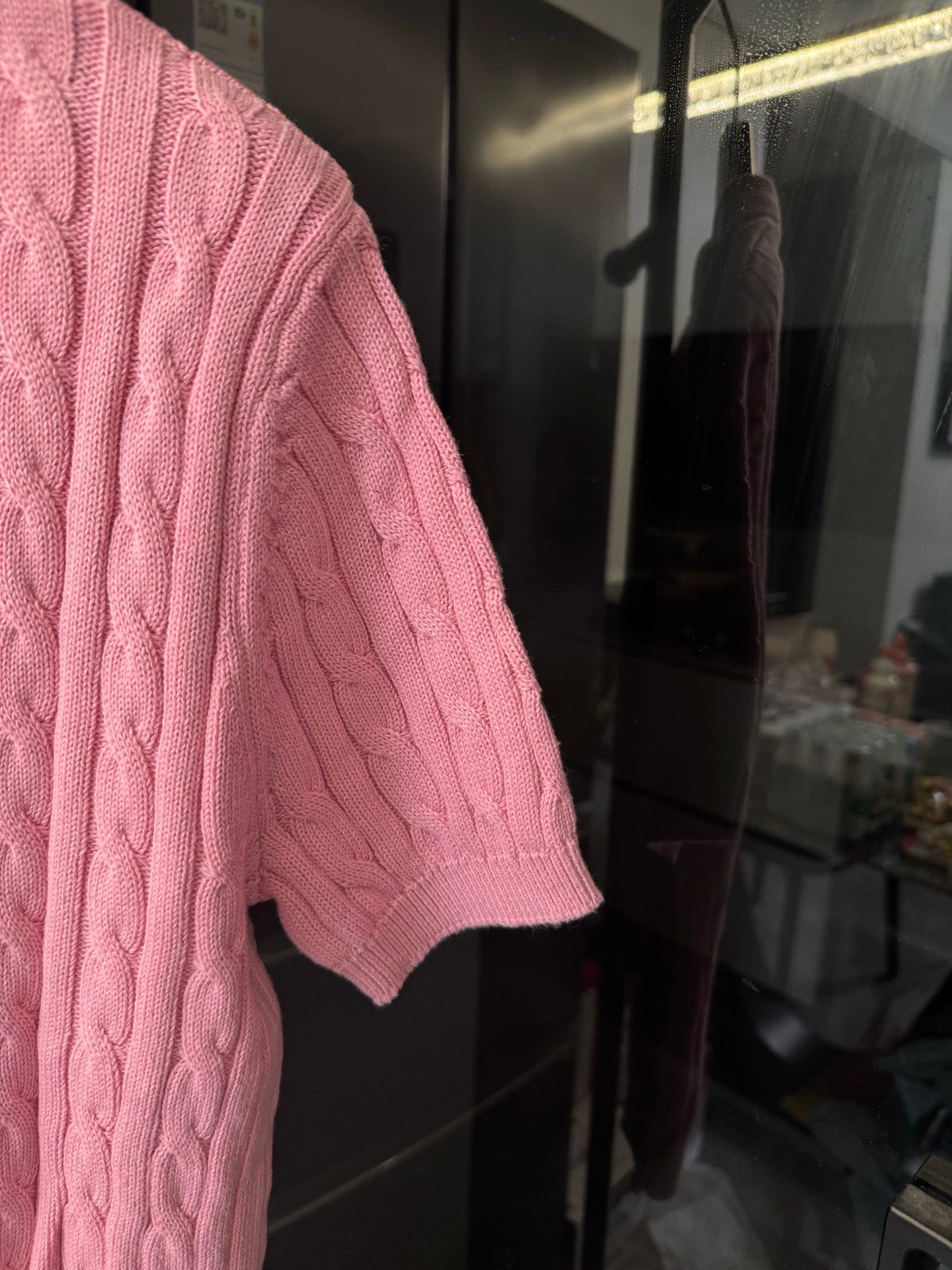 Pink cable-knit polo shirt sleeve with knit texture and RL chest emblem