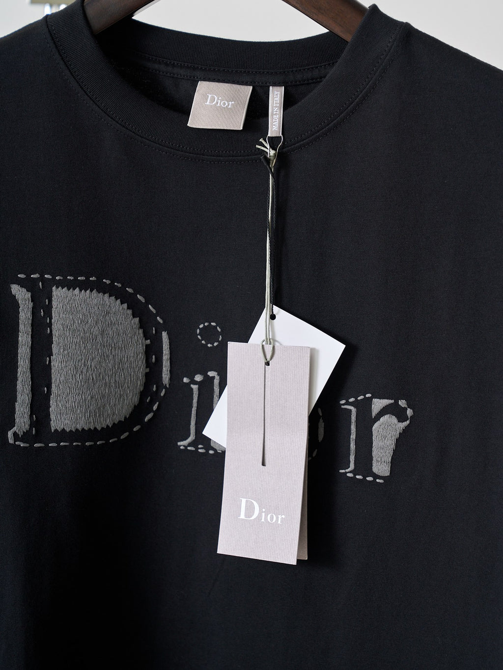Dior short-sleeve T-shirt close-up, black crew neck with Dior logo