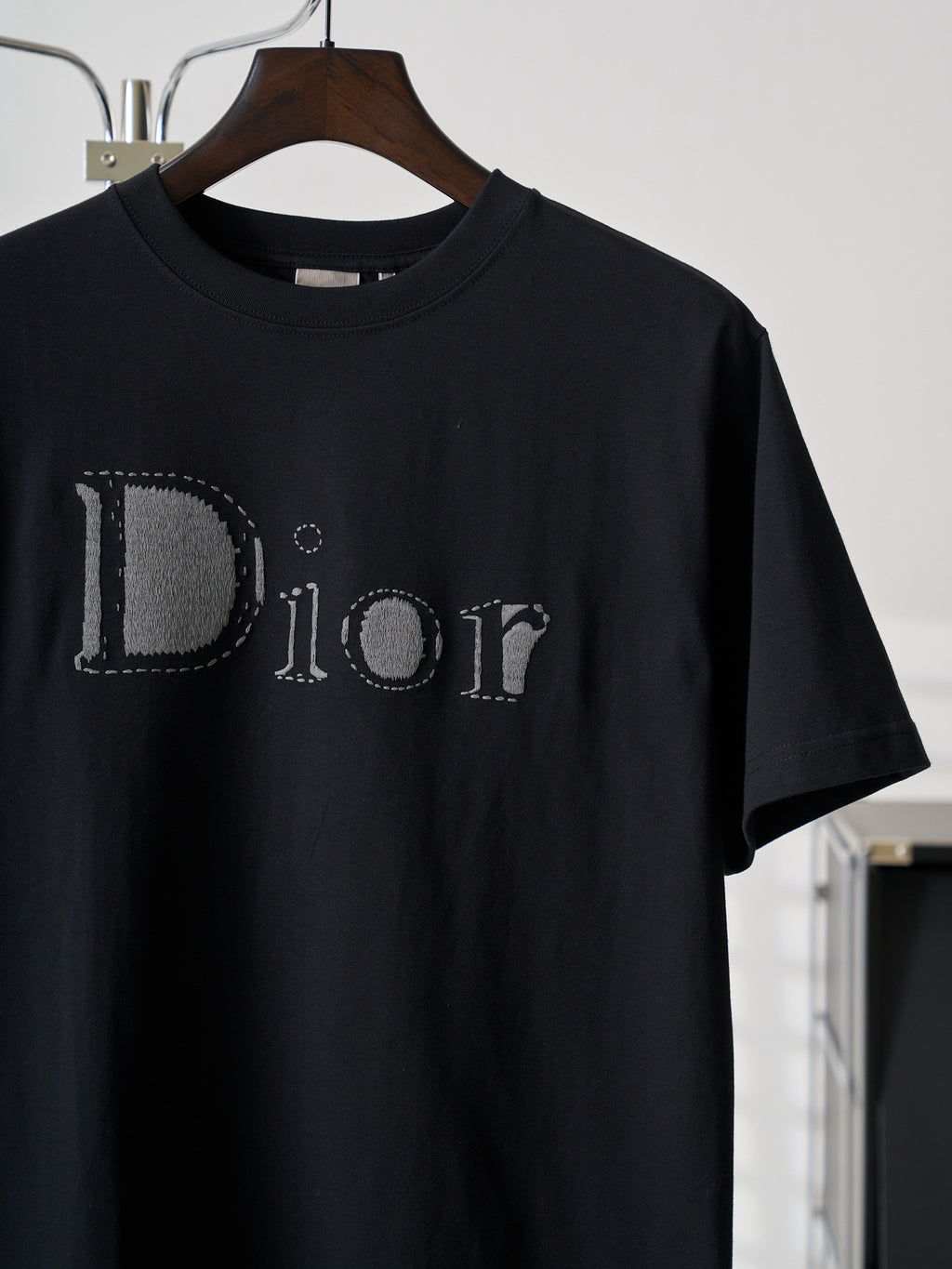Dior short-sleeve T-shirt close-up, black with stitched Dior logo
