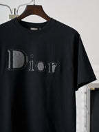 Dior short-sleeve T-shirt close-up, black with stitched Dior logo