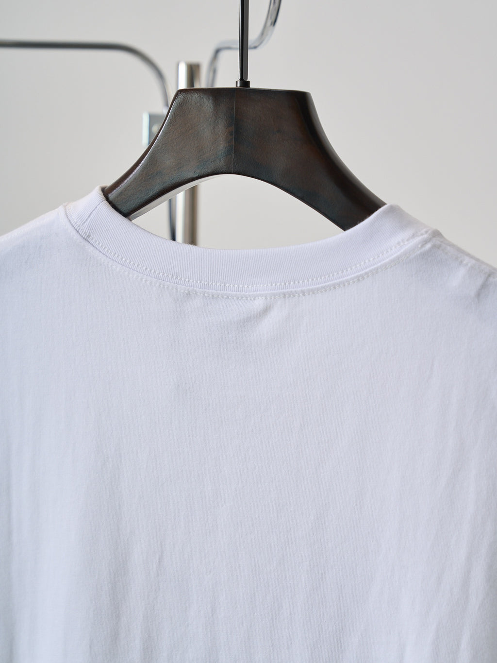 White T-shirt neckline and back yoke on hanger