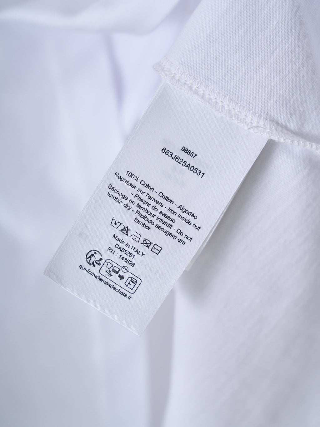 White T-shirt care label with washing symbols