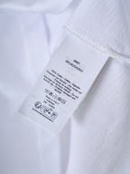 White T-shirt care label with washing symbols