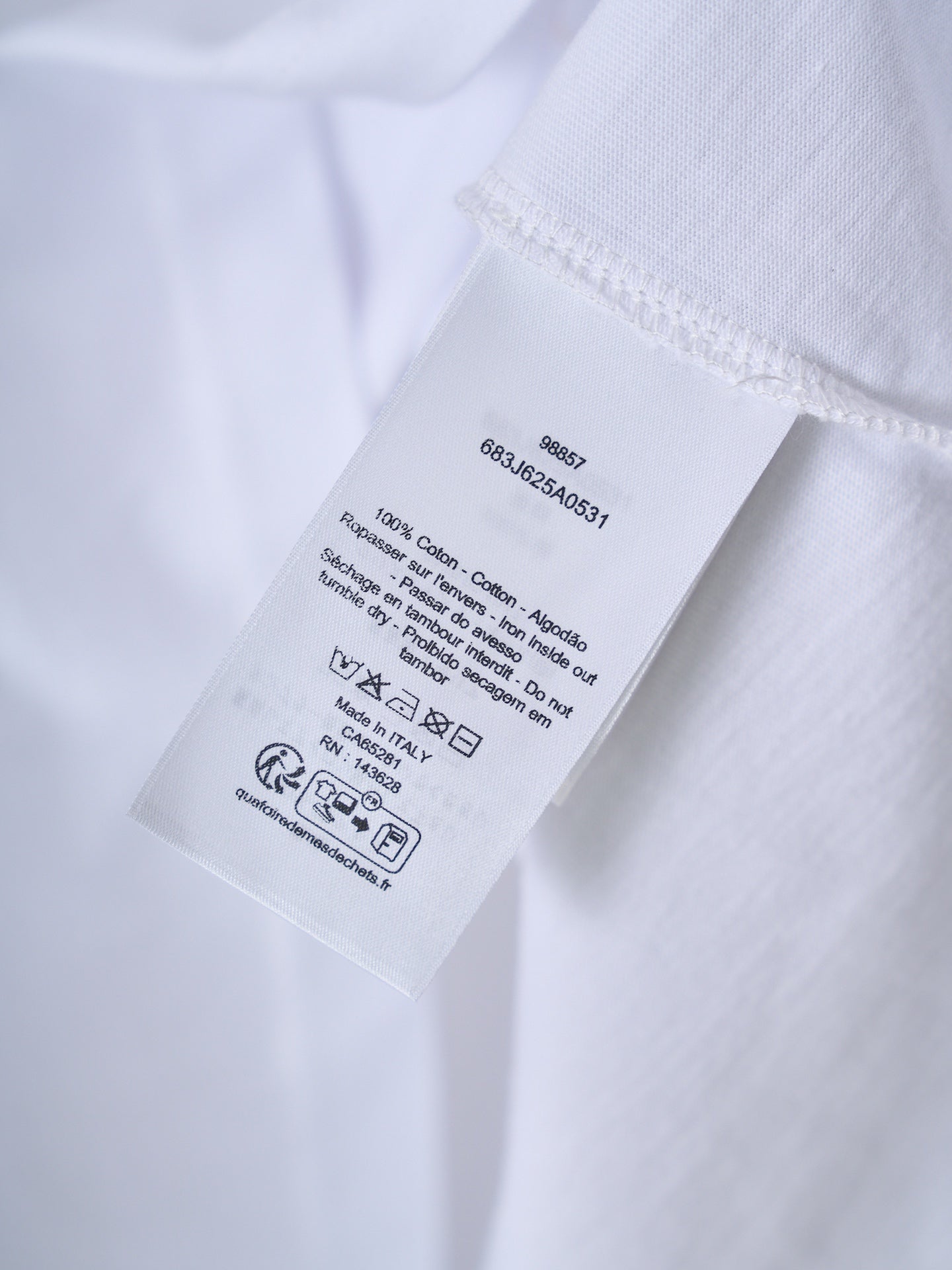 White T-shirt care label with washing symbols