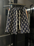 Gucci pants with navy GG monogram print, elastic waistband and drawstring ties
