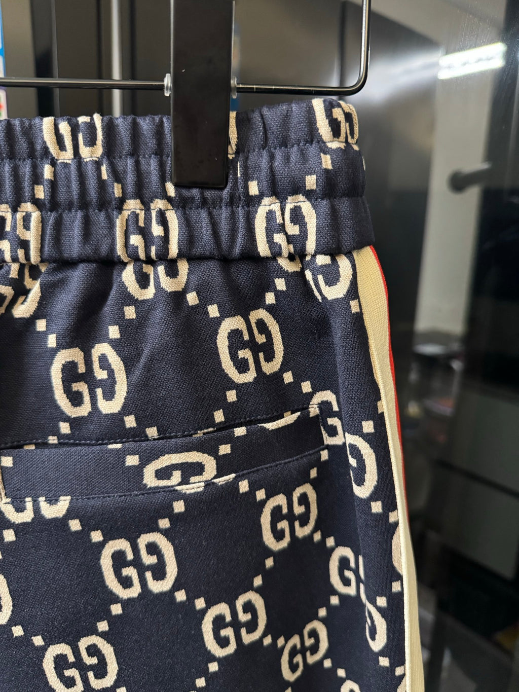Gucci pants pocket and front seam detail in navy with GG monogram print