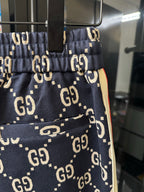 Gucci pants pocket and front seam detail in navy with GG monogram print