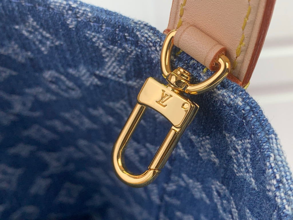 Louis Vuitton gold-tone carabiner clasp on tan strap with blue monogram