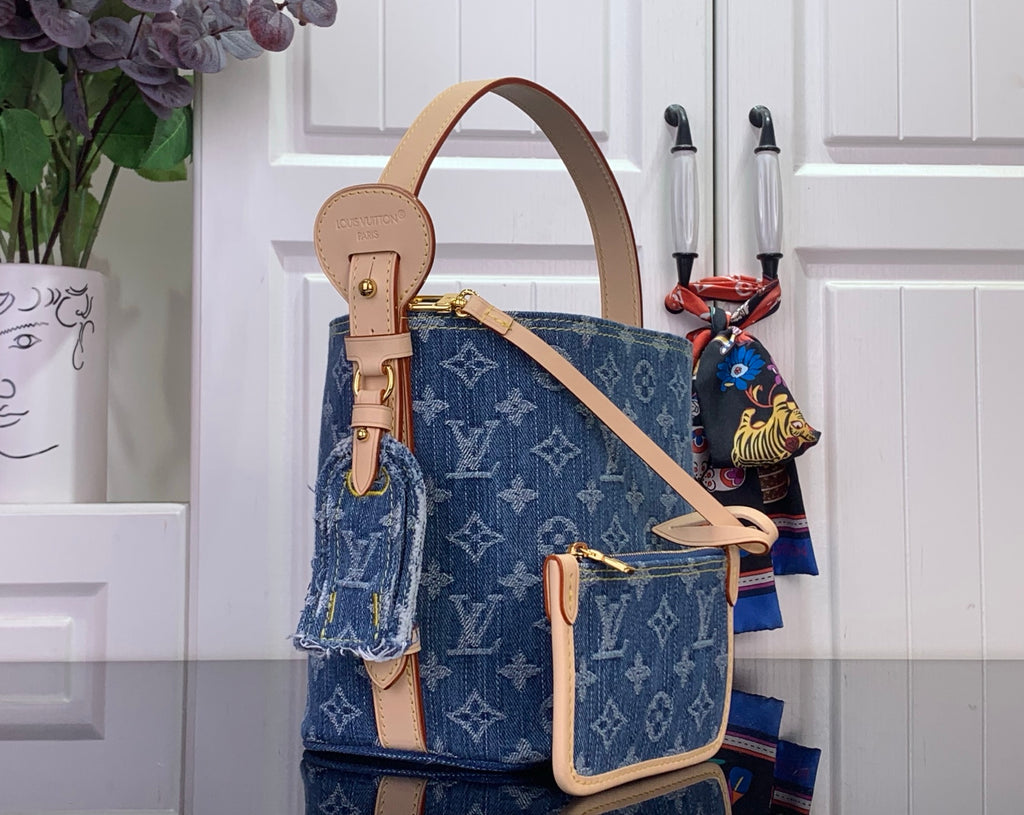 Louis Vuitton monogram tote bag with tan top handle and front mini pouch
