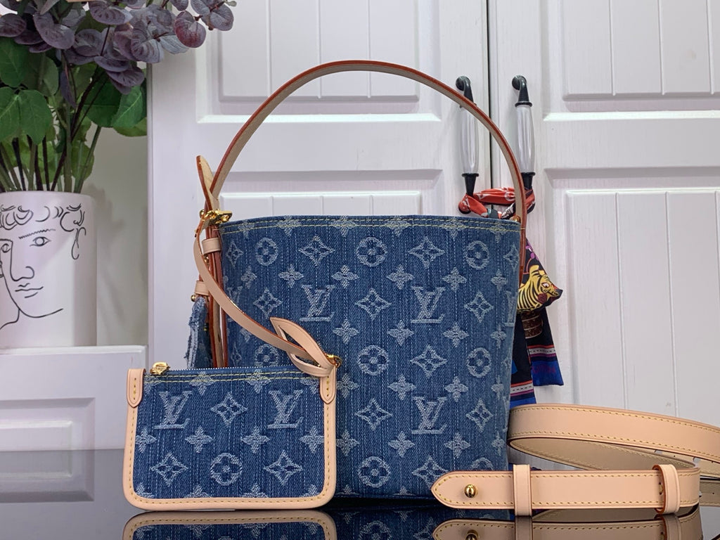 Louis Vuitton monogram tote bag in blue with tan leather straps and flap
