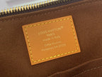 Louis Vuitton monogram bag interior leather label with stamped text and stitching.