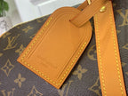 Louis Vuitton leather luggage tag with tan stitching on monogram duffel strap.