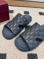 Gucci dark blue GG embossed slide sandals with wide straps and open toe
