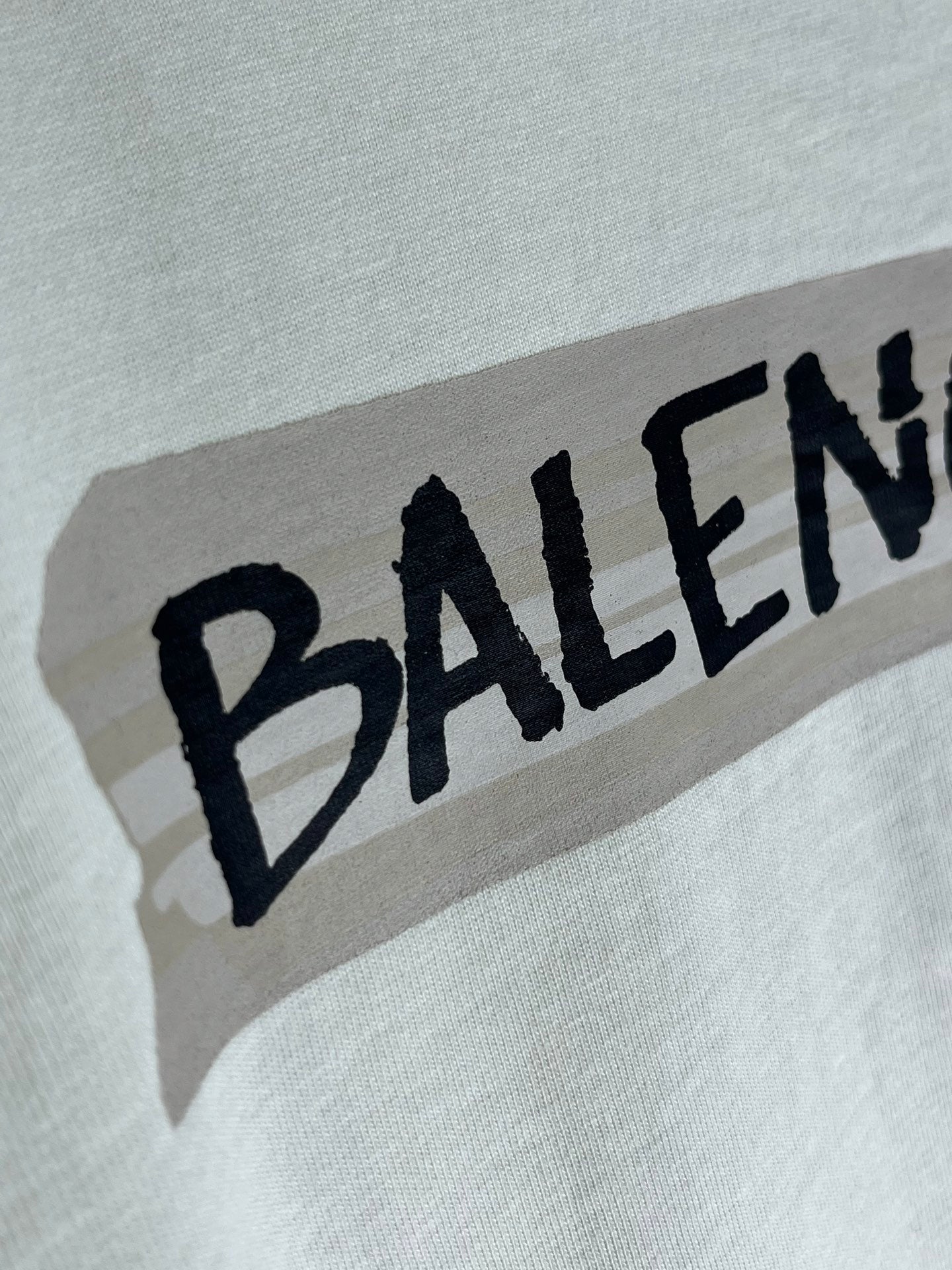 White Balenciaga T-shirt with large black BALENCIAGA logo near neckline