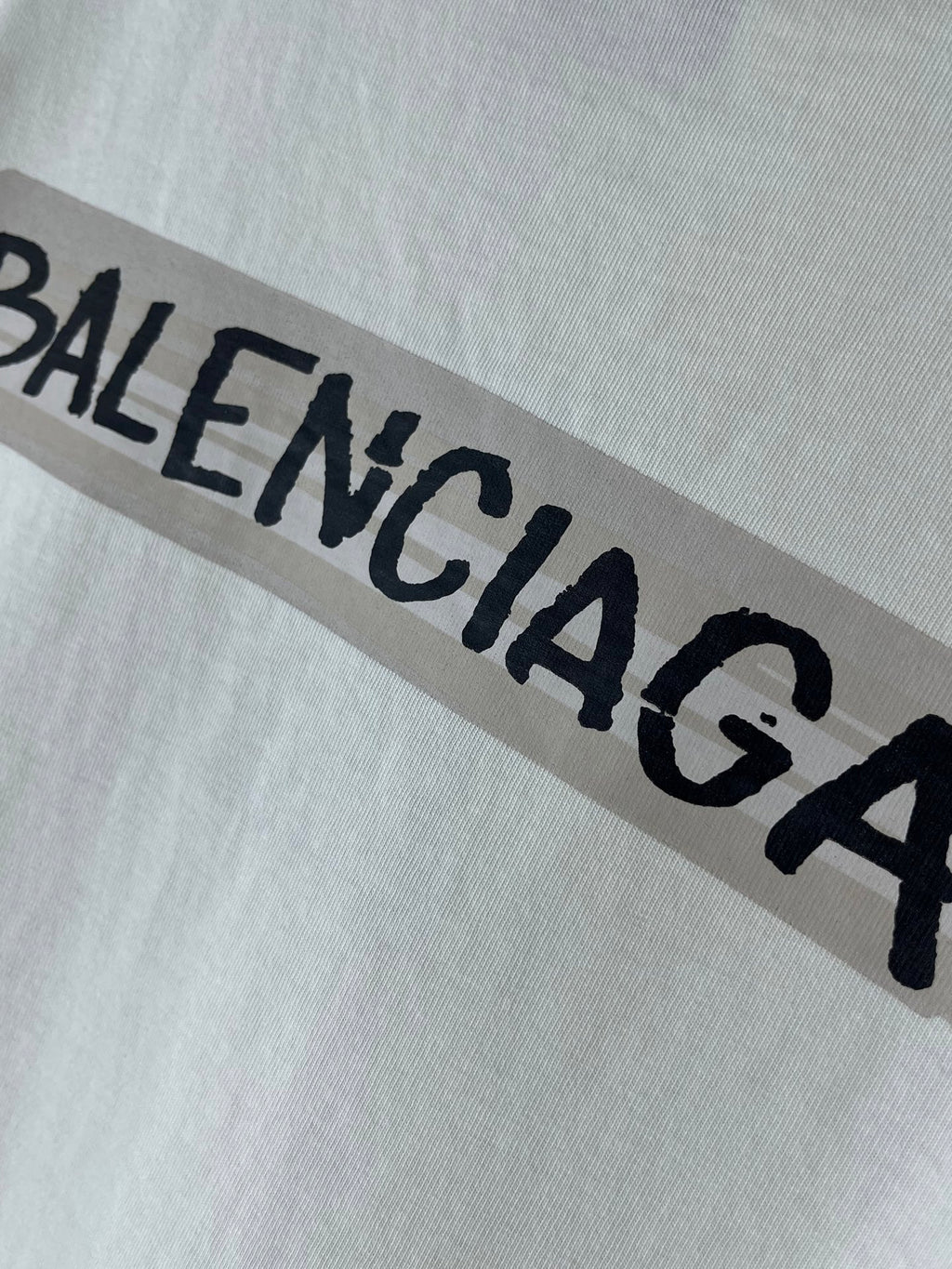 White Balenciaga T-shirt with bold black BALENCIAGA logo across chest