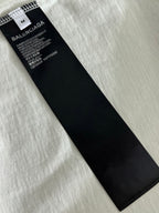 Black Balenciaga size and care label inside white T-shirt