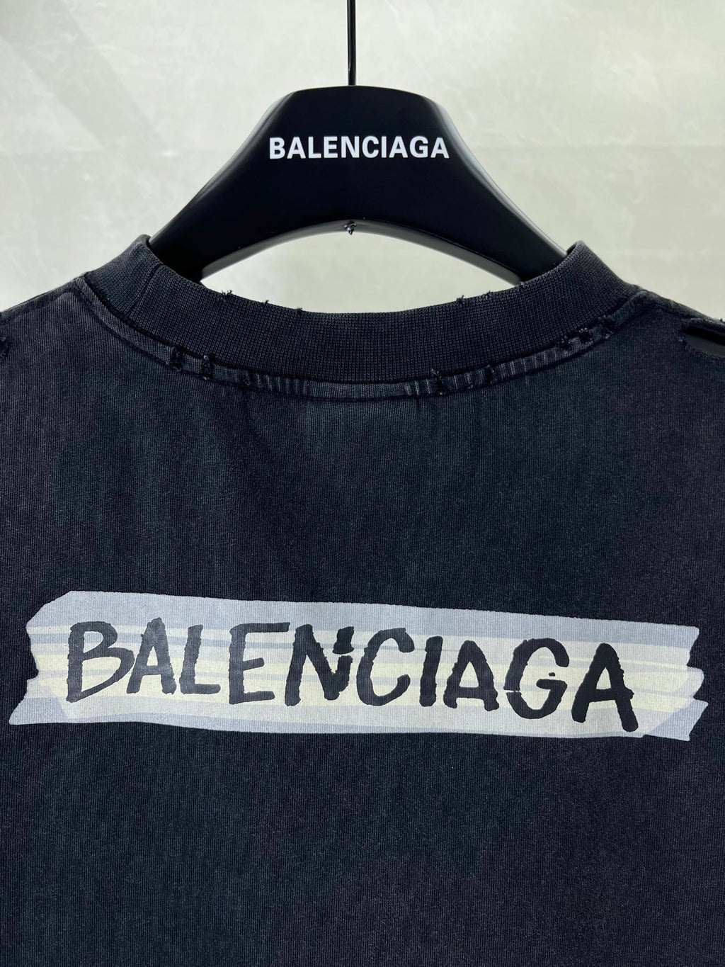Dark navy short-sleeve T-shirt with large BALENCIAGA logo across chest