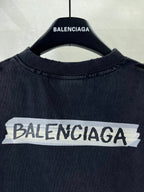 Dark navy short-sleeve T-shirt with large BALENCIAGA logo across chest