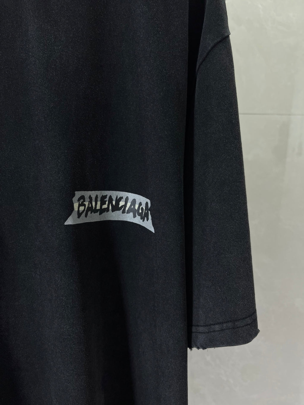 Dark navy short-sleeve T-shirt with BALENCIAGA logo patch on sleeve