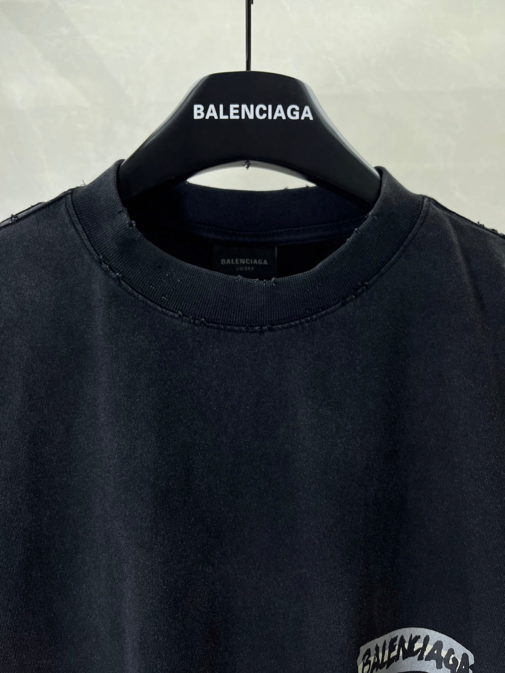 Dark navy short-sleeve T-shirt neckline with BALENCIAGA branding on collar
