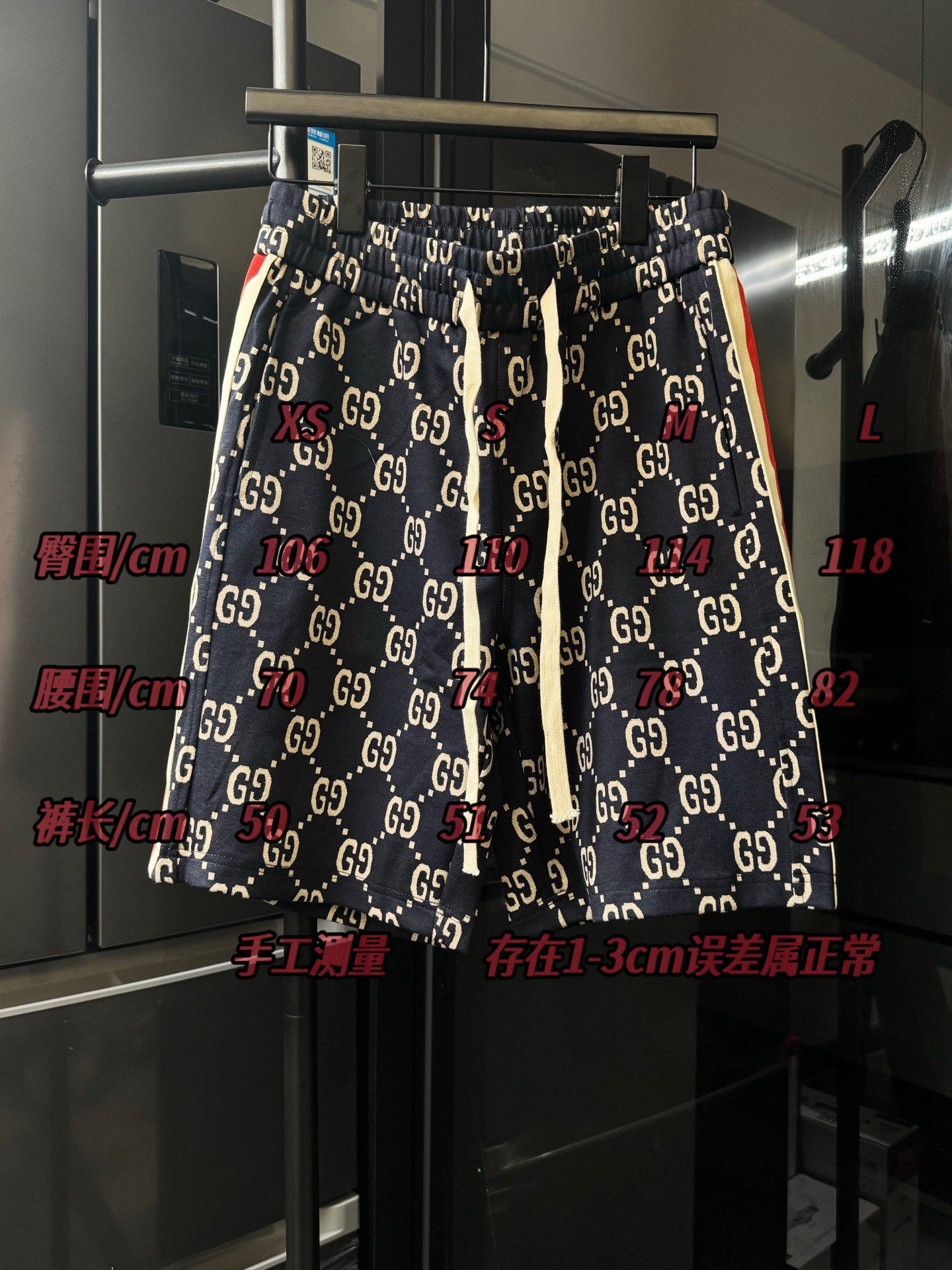 Gucci pants with navy GG monogram print and elastic waistband, side view