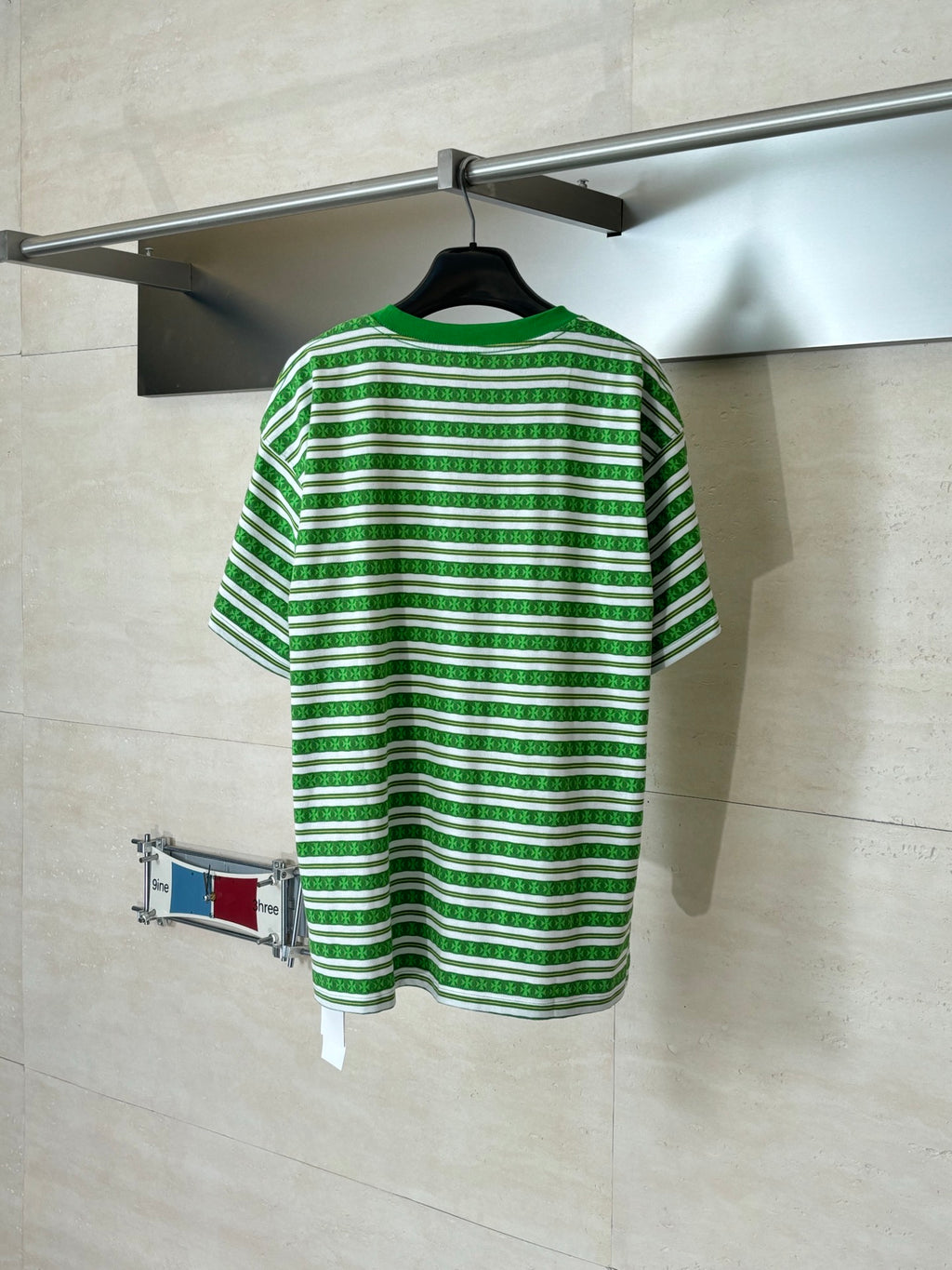 Green striped short-sleeve T-shirt on hanger, crew neck, logo at chest back