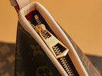 Louis Vuitton monogram bag interior view with gold zipper tracks and fabric lining