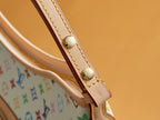 Multicolor monogram handbag handle strap with gold snap buttons and stitching