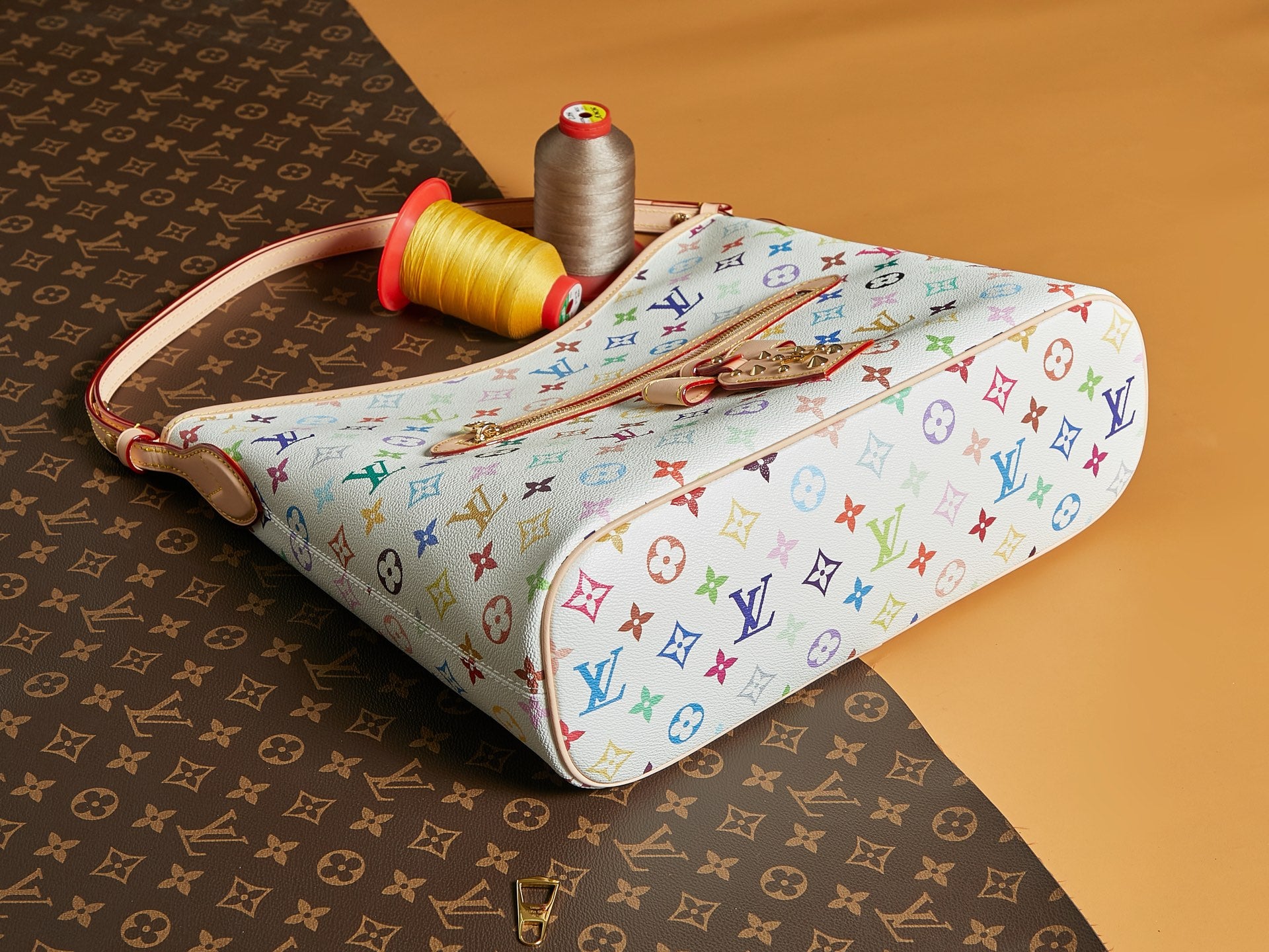 Multicolor monogram handbag with top handle and side zipper on structured base