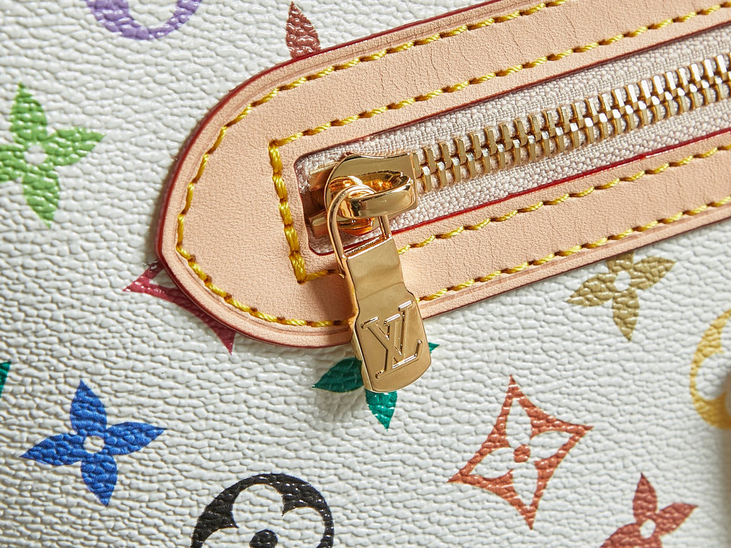 Multicolor monogram handbag close-up of gold zipper pull and metal corner ring
