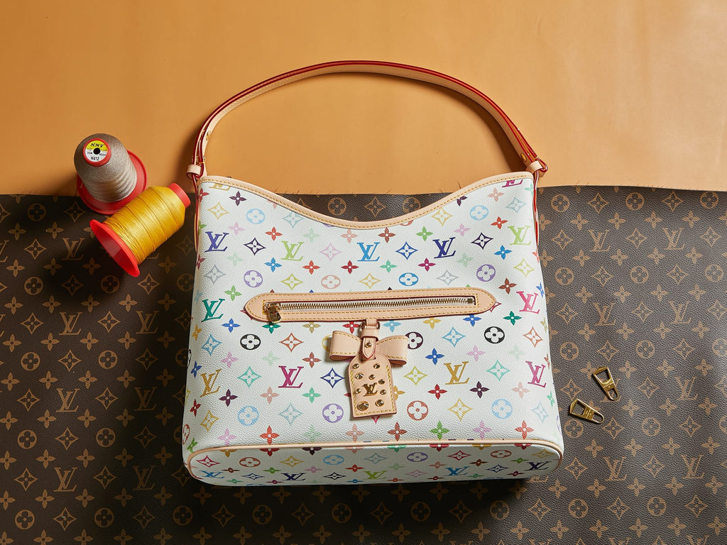 Louis Vuitton multicolor monogram handbag with top handle and front snap clasp