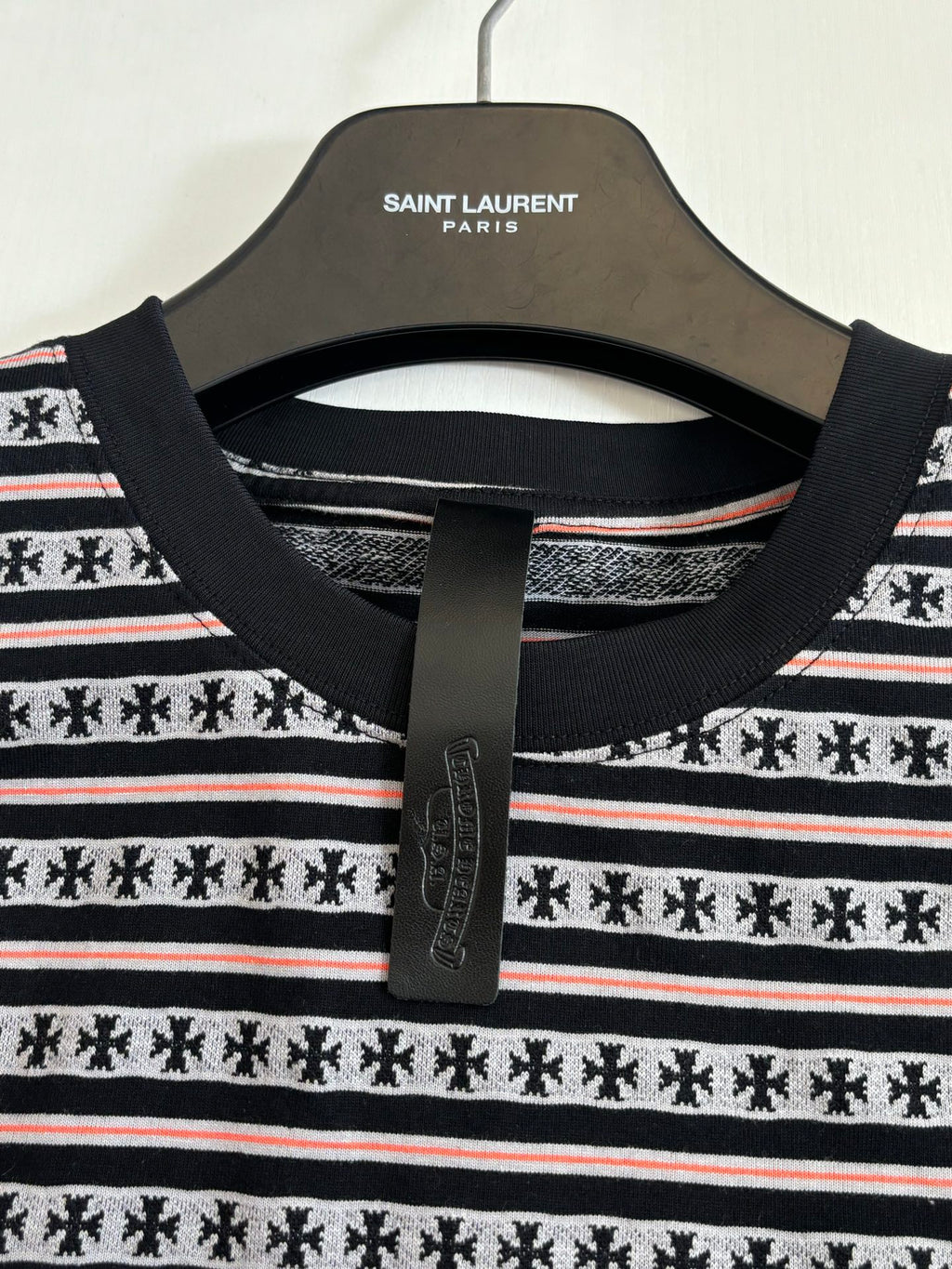 Crew-neck T-shirt neckline with black collar and black-and-white striped knit
