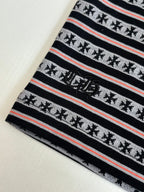 Close-up of striped T-shirt knit with small motif icons and red accent lines
