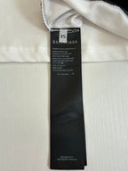 White denim shorts with XS Balenciaga size and care label at waistband
