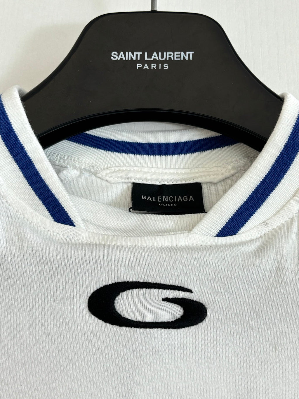 Balenciaga jersey neckline with black SAINT LAURENT PARIS hang label and blue-striped trim