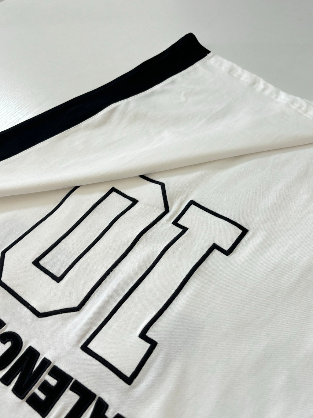 Balenciaga jersey front close-up with large number 10 graphic outline on white