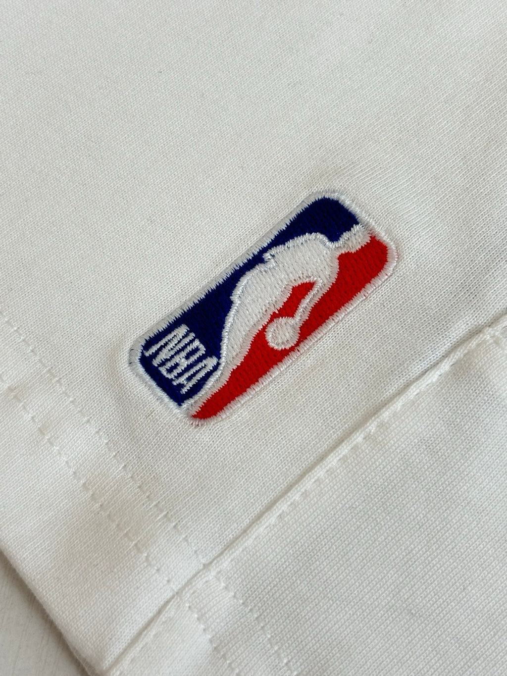 White denim shorts with embroidered Balenciaga logo patch on front