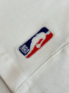White denim shorts with embroidered Balenciaga logo patch on front