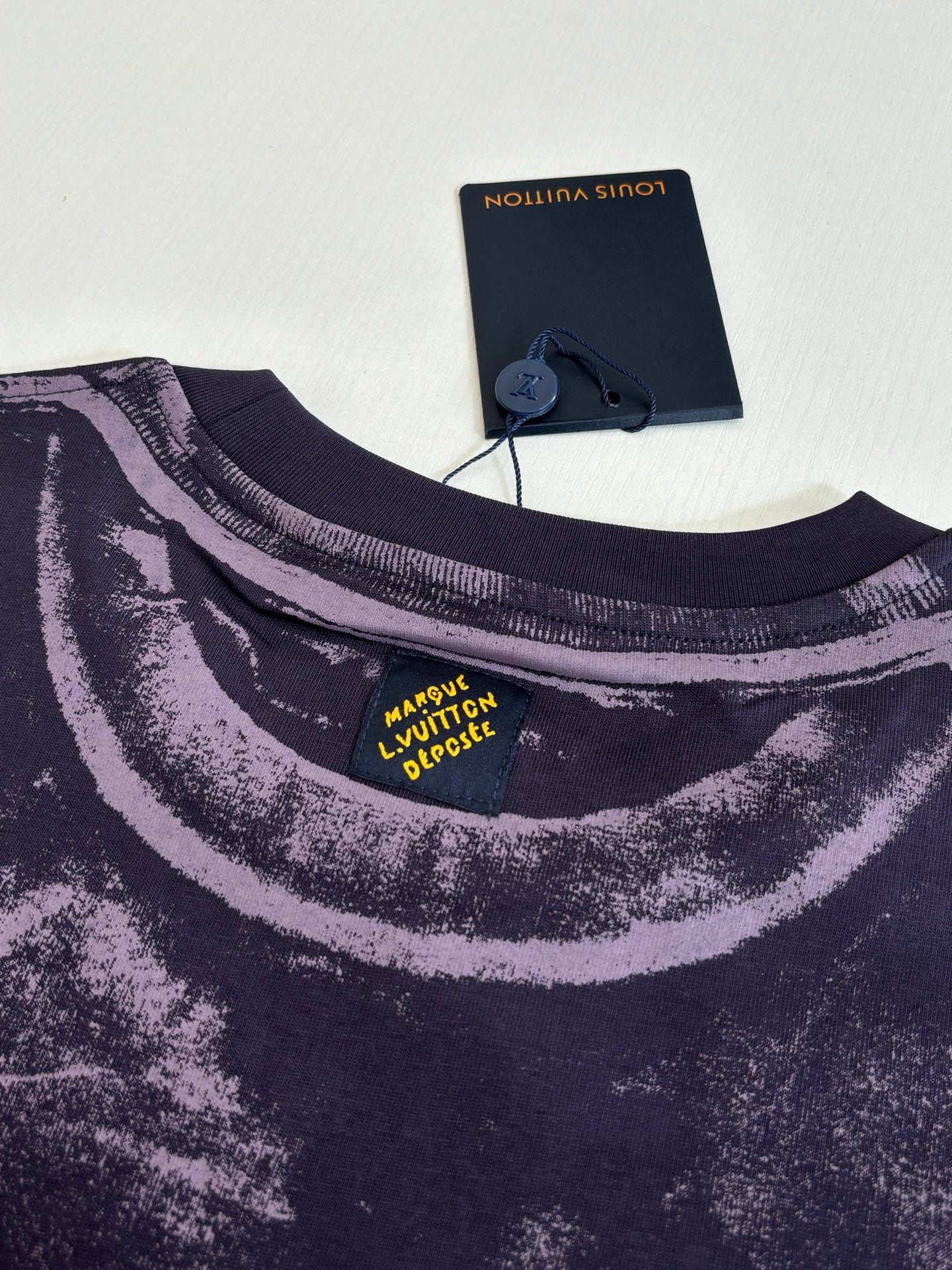Louis Vuitton T-shirt neck detail with printed label at collar