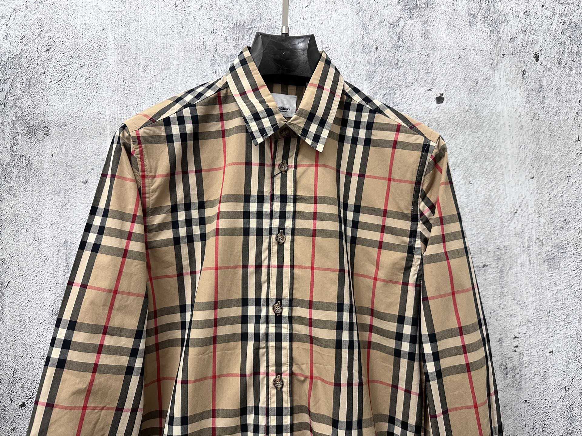 Burberry long-sleeve button-up shirt front, beige plaid with navy and red lines
